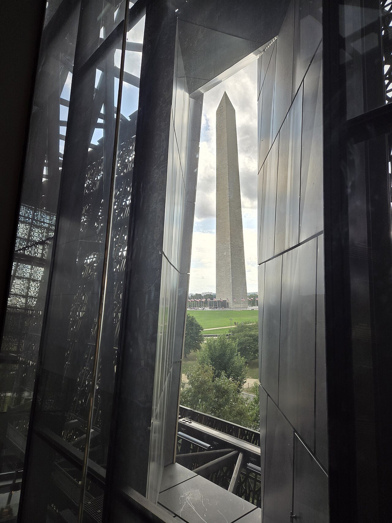 The Washington Monument framed by a window of the African American History and Culture museum