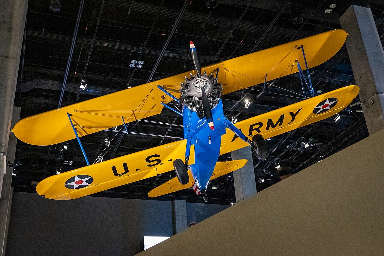 The Tuskegee Airmen's yellow training biplane, Spirit of Tuskegee, hanging in the museum
