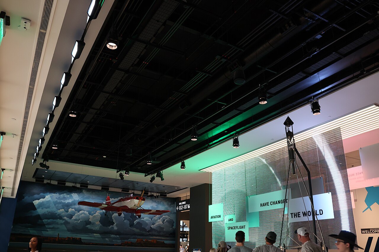 A new gallery in the renovated Air and Space Museum, a painted sky behind the aircraft