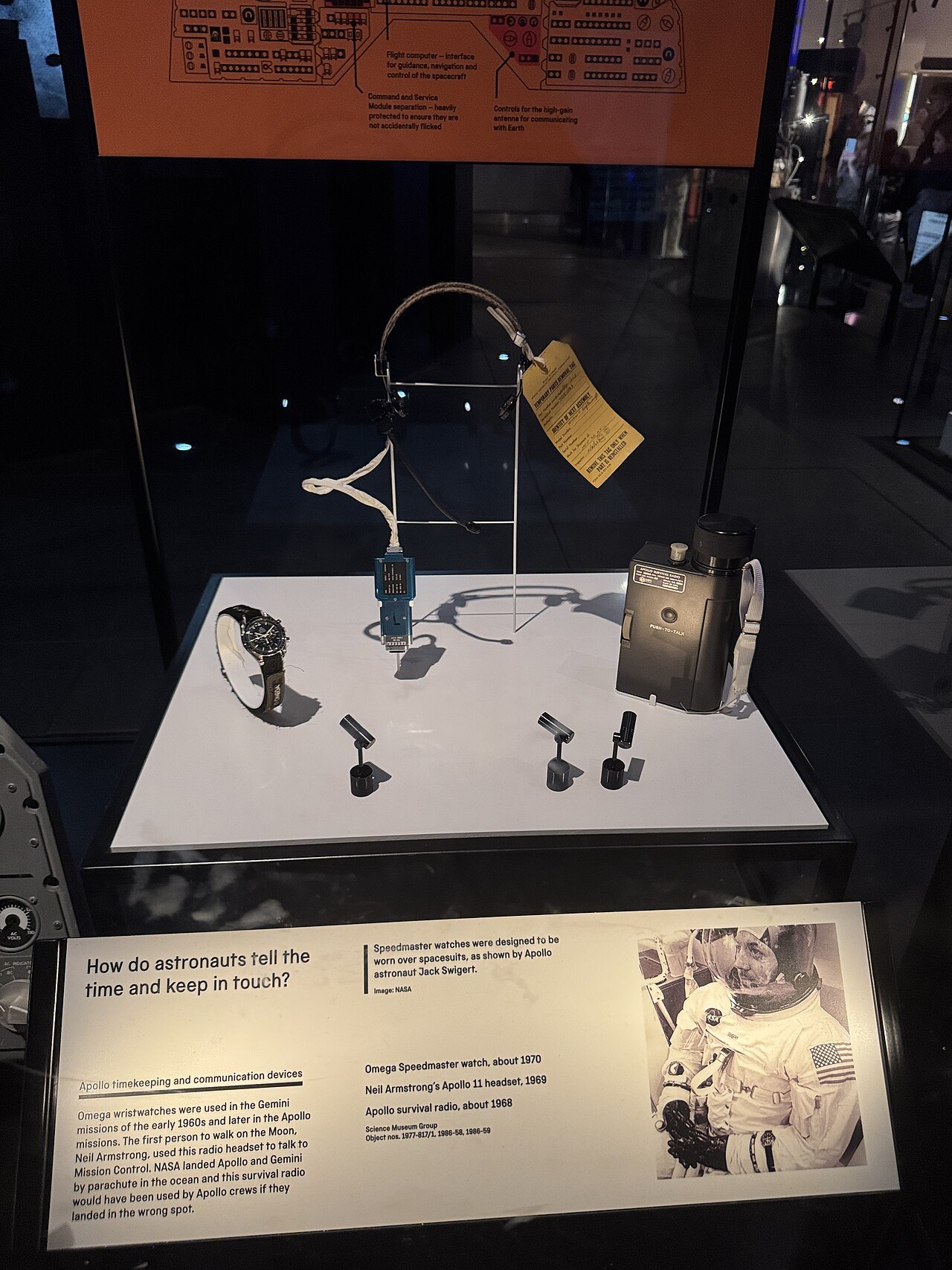 A headset from the Apollo 11 command module in a display case, with its label