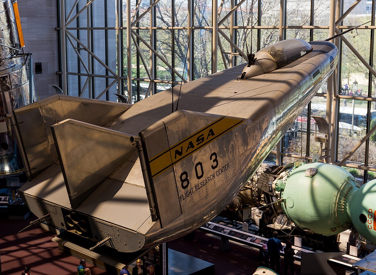The M2-F3 lifting body, an experimental wingless aircraft, hanging above the gallery