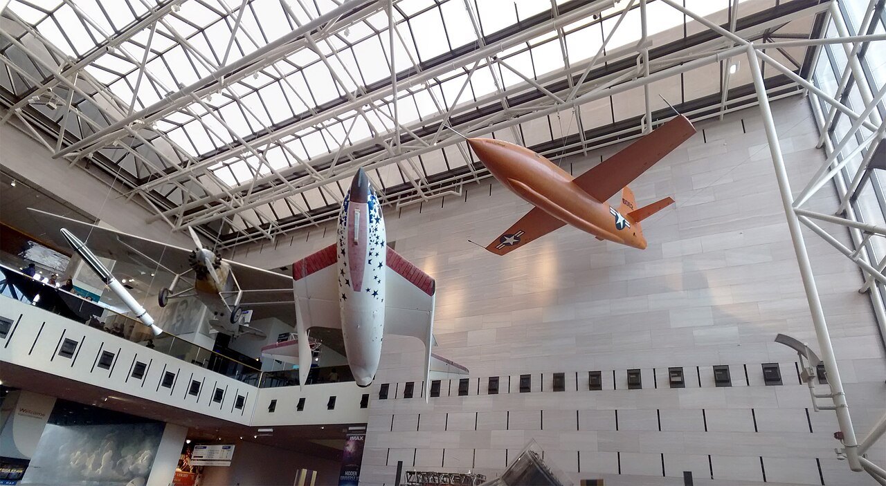 The Bell X-1 and SpaceShipOne hanging under the skylights of the museum's main hall