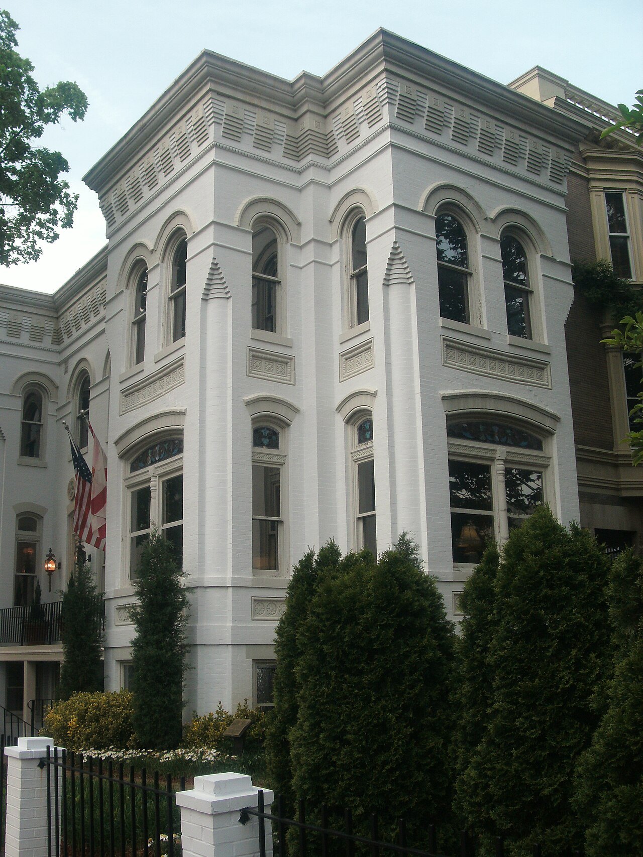A white Italianate rowhouse on Capitol Hill