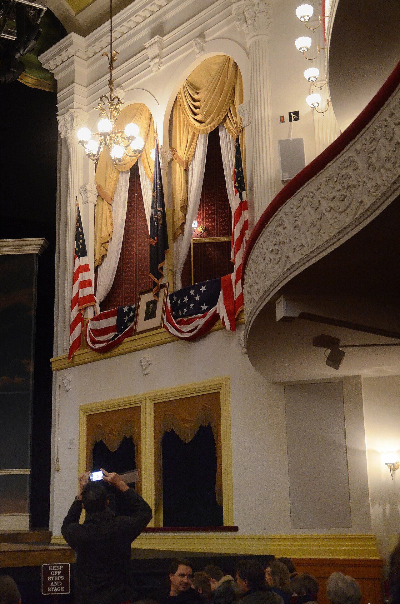 The presidential box at Ford's Theatre, hung with flags, above the stalls
