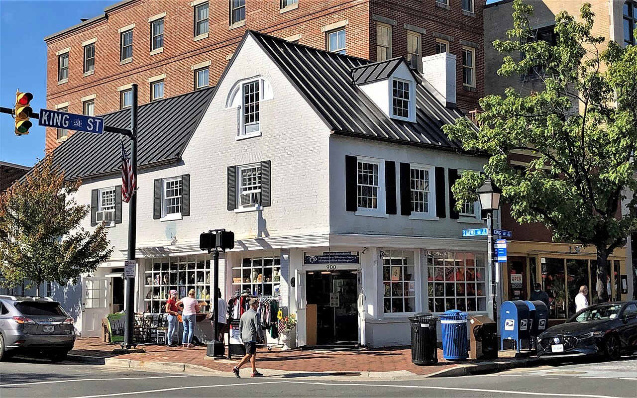 A white clapboard corner shop at King Street and South Alfred Street in Old Town Alexandria