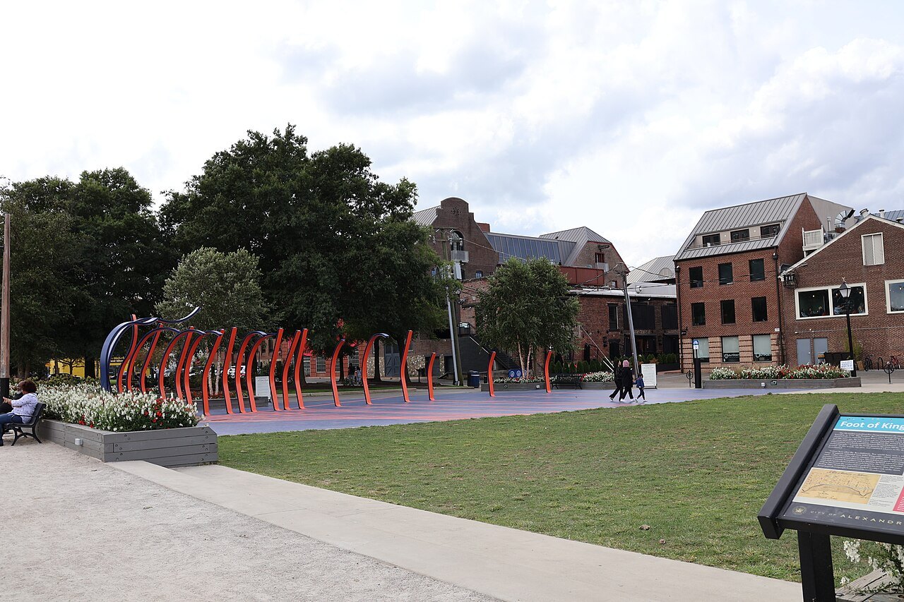 Waterfront Park in Old Town Alexandria, with a red sculpture on the lawn