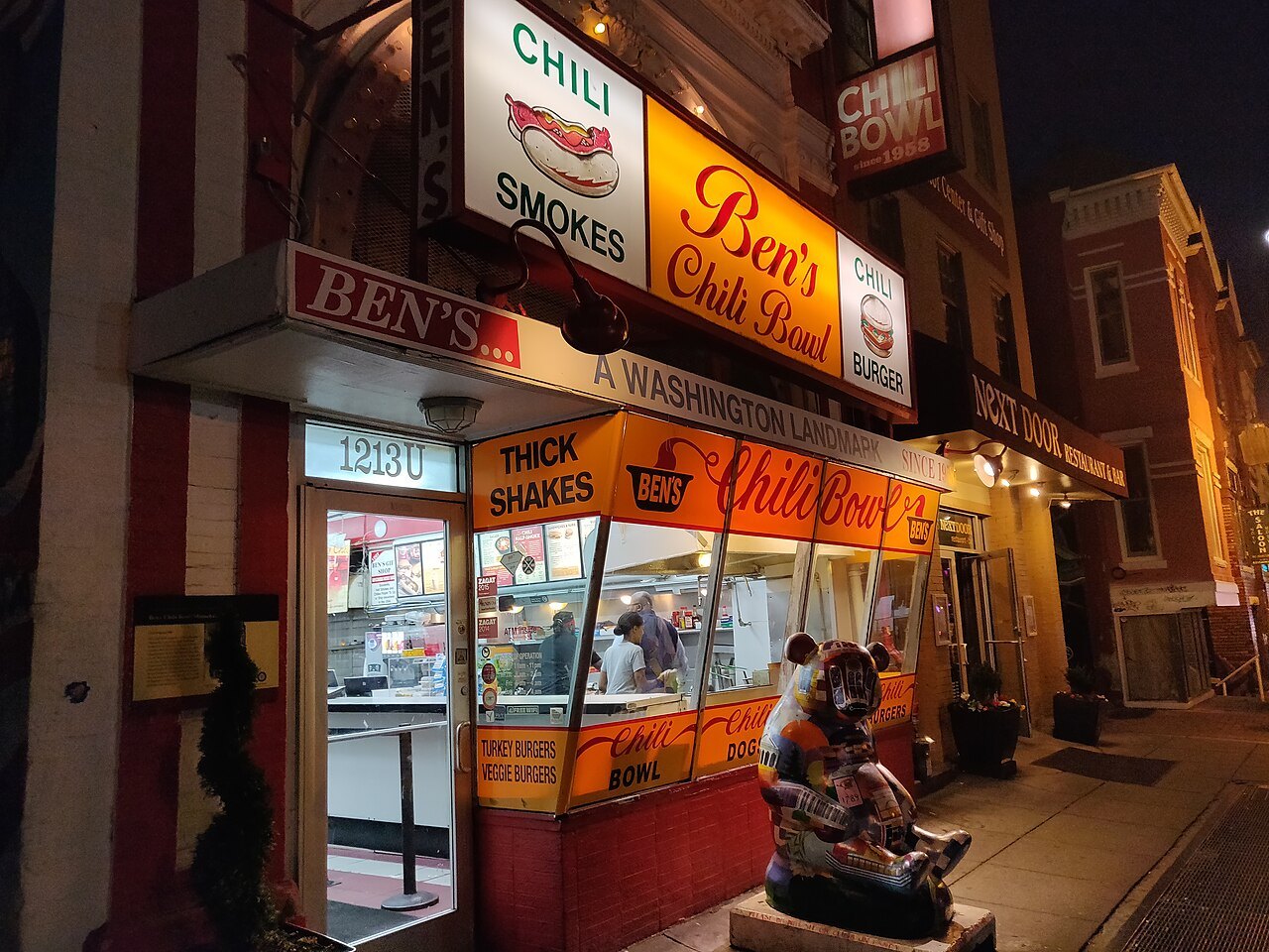 Ben's Chili Bowl's counter and sign lit up at night on U Street