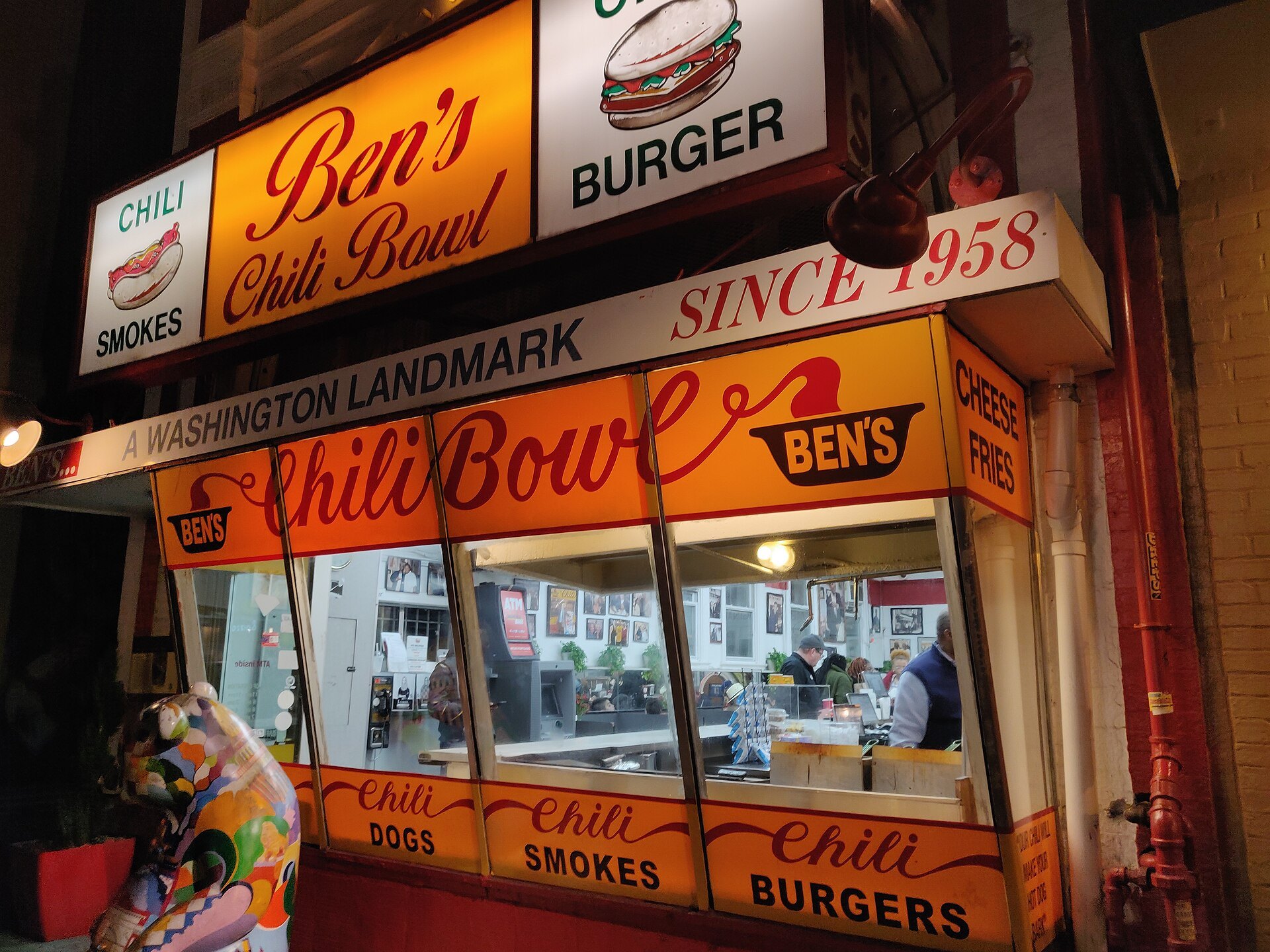 Ben's Chili Bowl on U Street at night, its orange sign reading since 1958