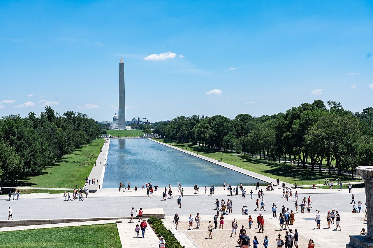 The Reflecting Pool and the Washington Monument from the Lincoln Memorial steps, crowds on the plaza