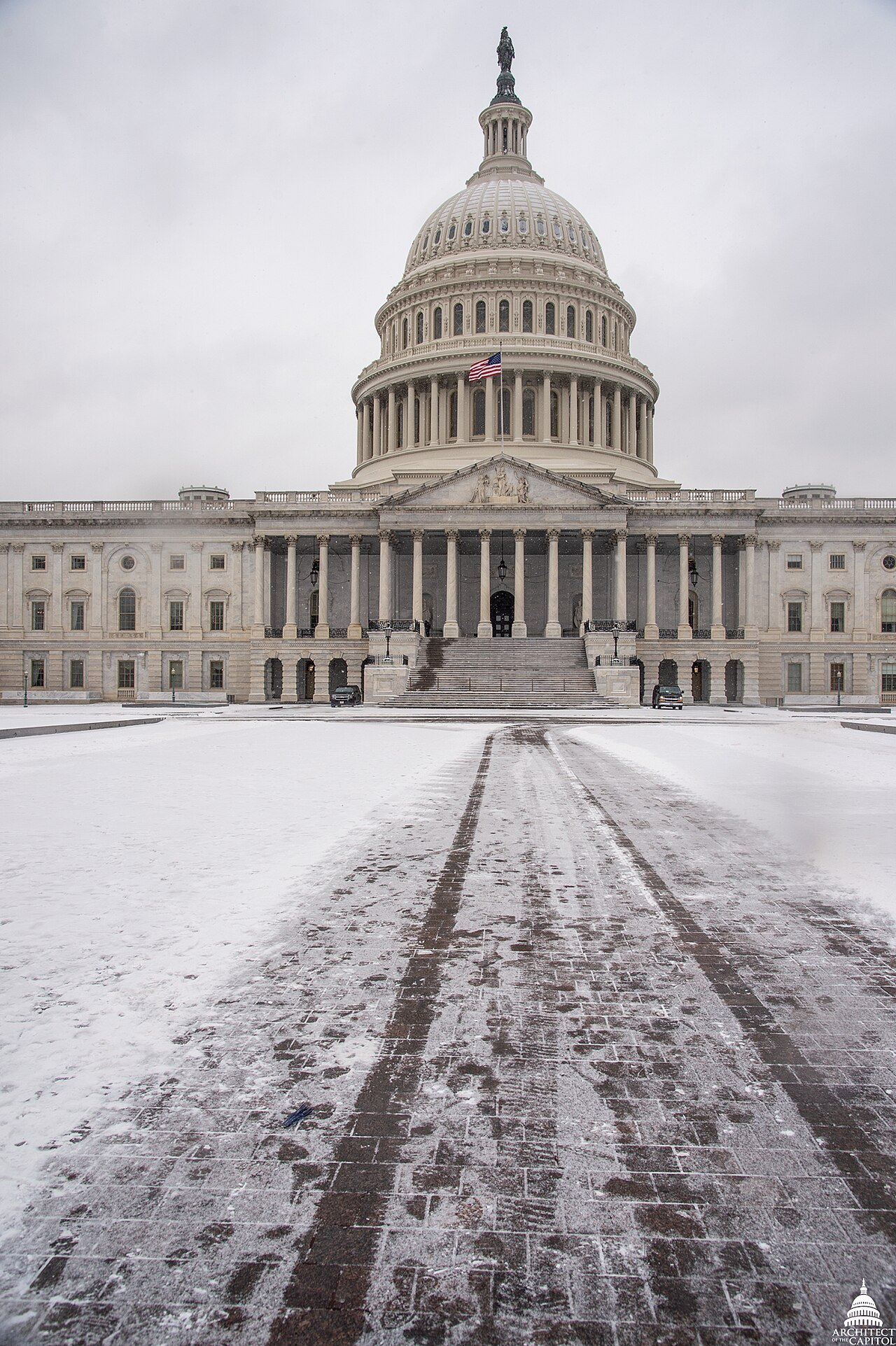 The Capitol's East Front over the snow-covered plaza in February