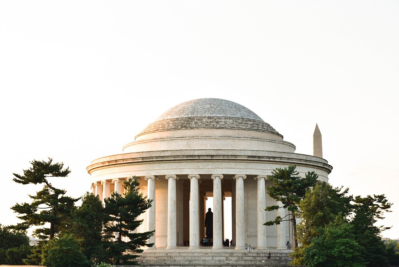 The Jefferson Memorial on a summer evening, the Monument's tip beyond the dome