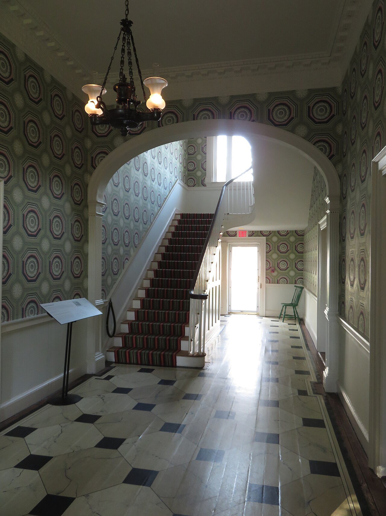 A stair and checkered floor inside Dumbarton House in Georgetown