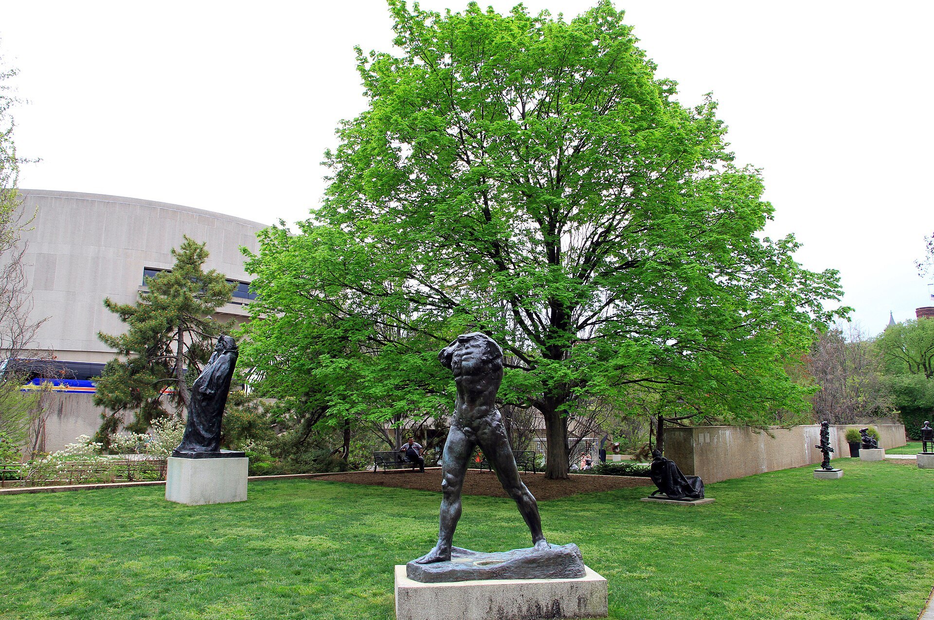 Rodin's Walking Man in the Hirshhorn's sculpture garden, the museum's drum behind