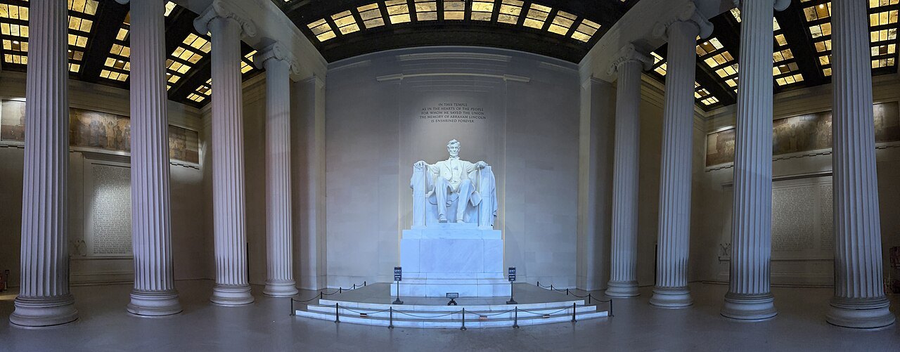 The statue of Lincoln between the columns of the memorial's central chamber