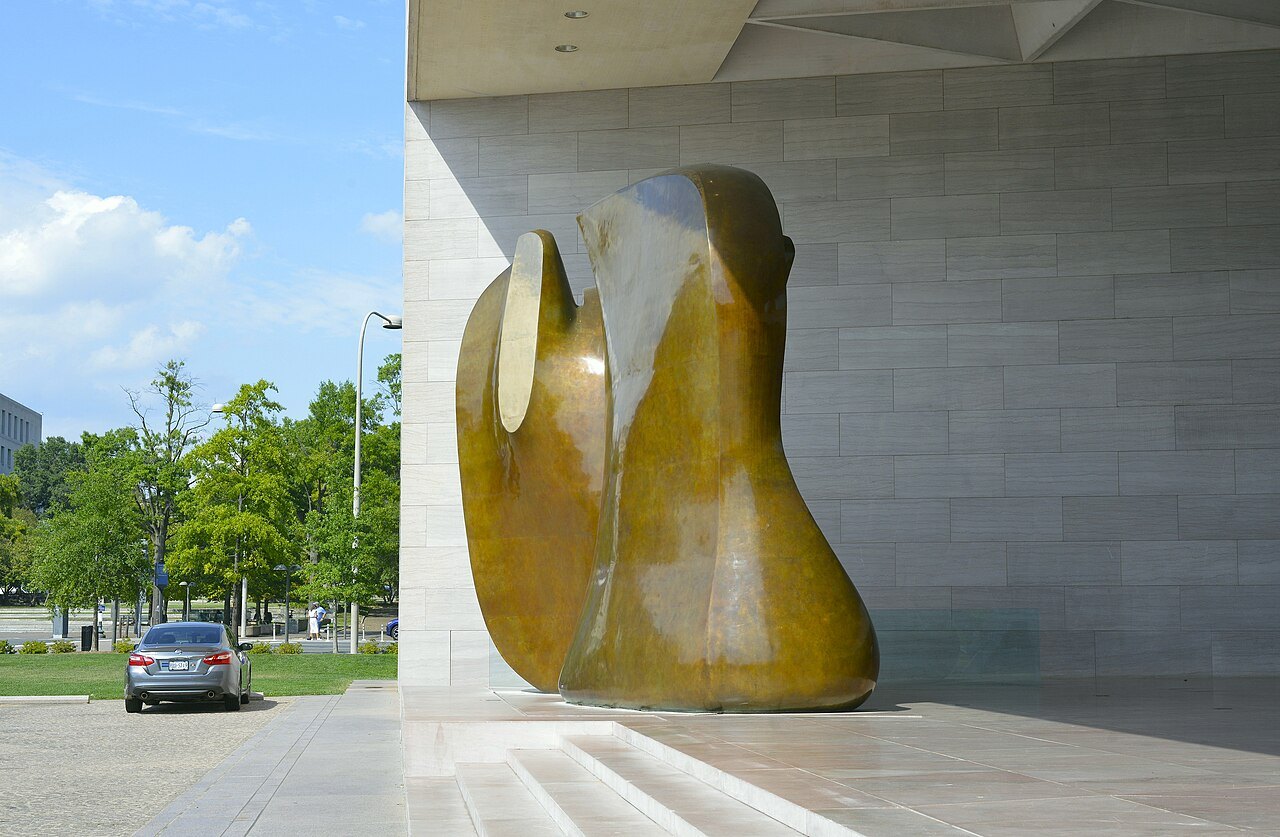 A sculpture by the East Building's sharp stone corner