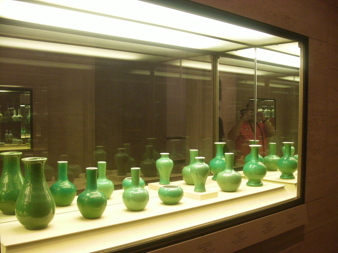 Chinese porcelain vases in a lit case in the West Building