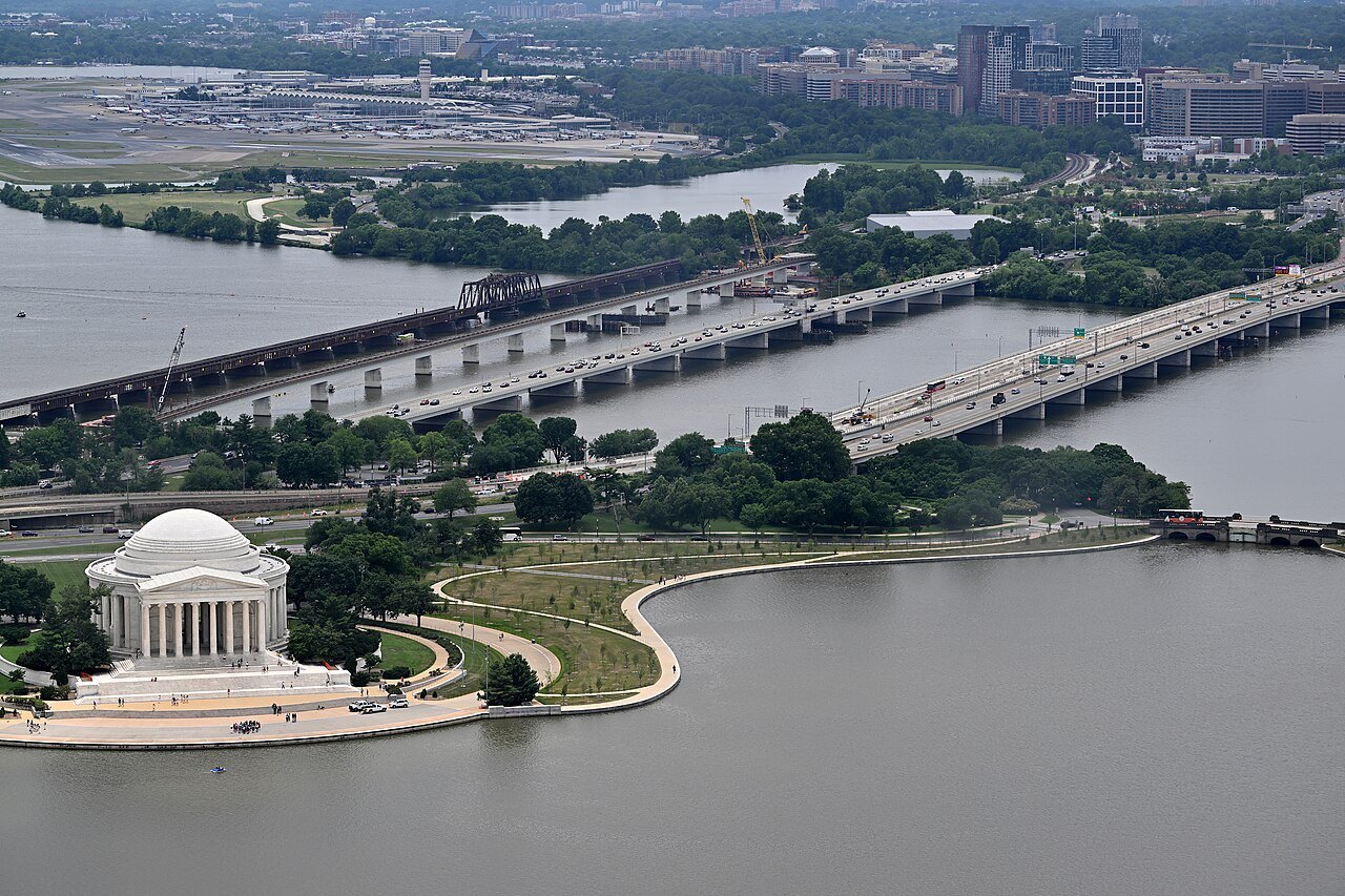 The Jefferson Memorial and the Tidal Basin from high above, the Potomac bridges beyond