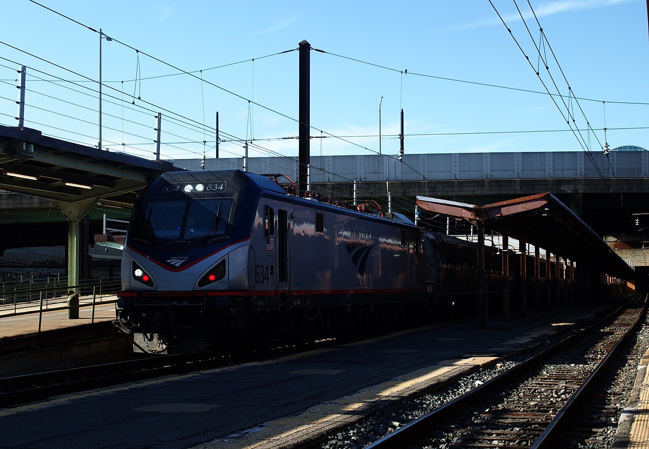 An Amtrak train leaving Union Station under the overhead wires