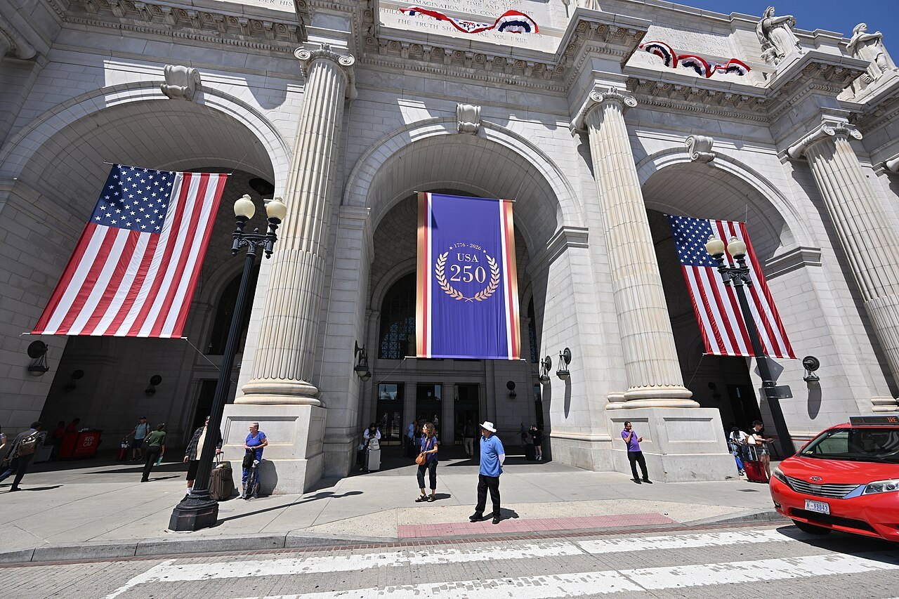 The central arches of Union Station, hung with flags and a banner