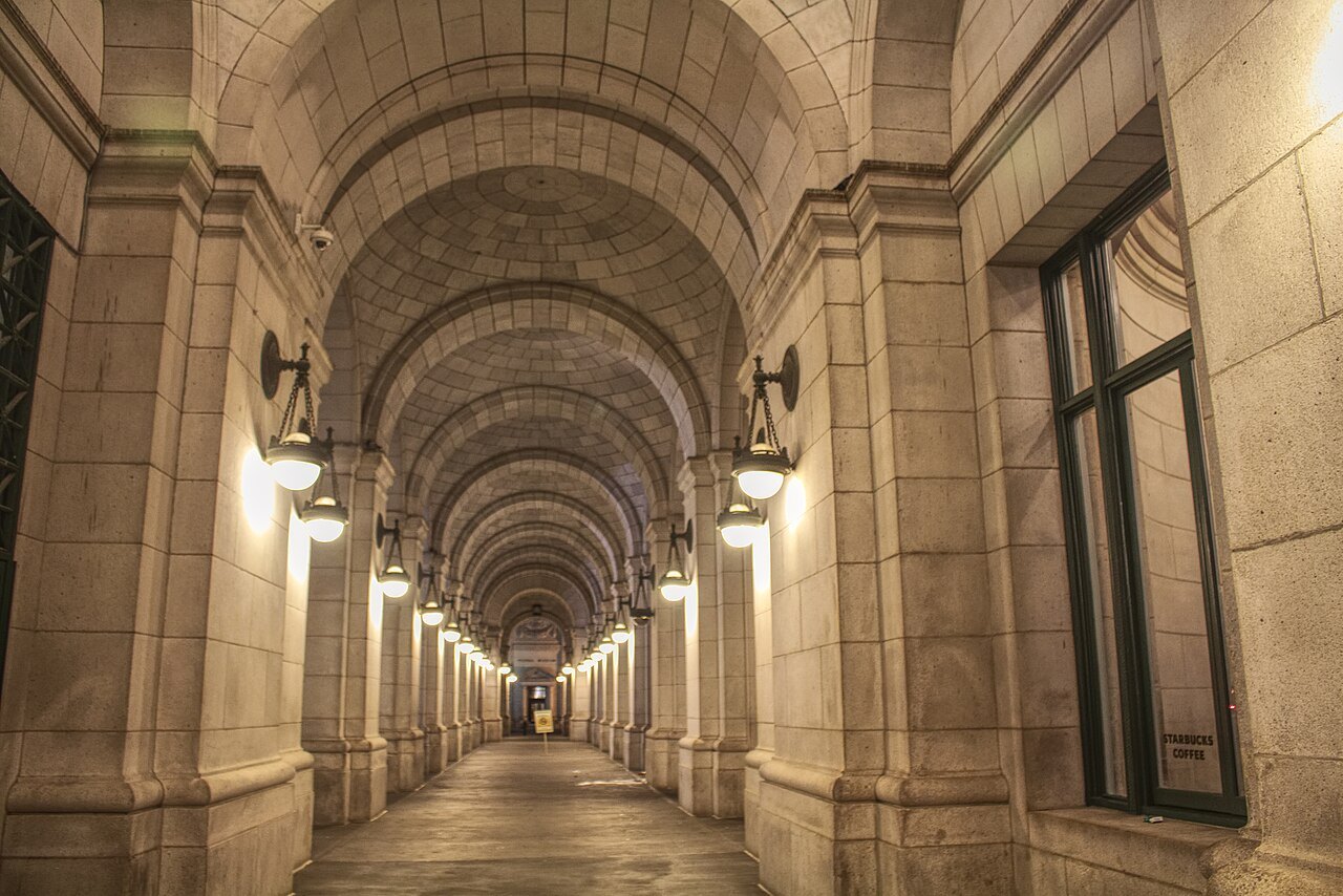 A lamplit arcade along the side of Union Station