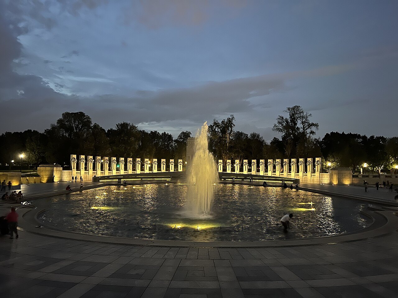 The World War II Memorial's fountain and pillars lit at dusk