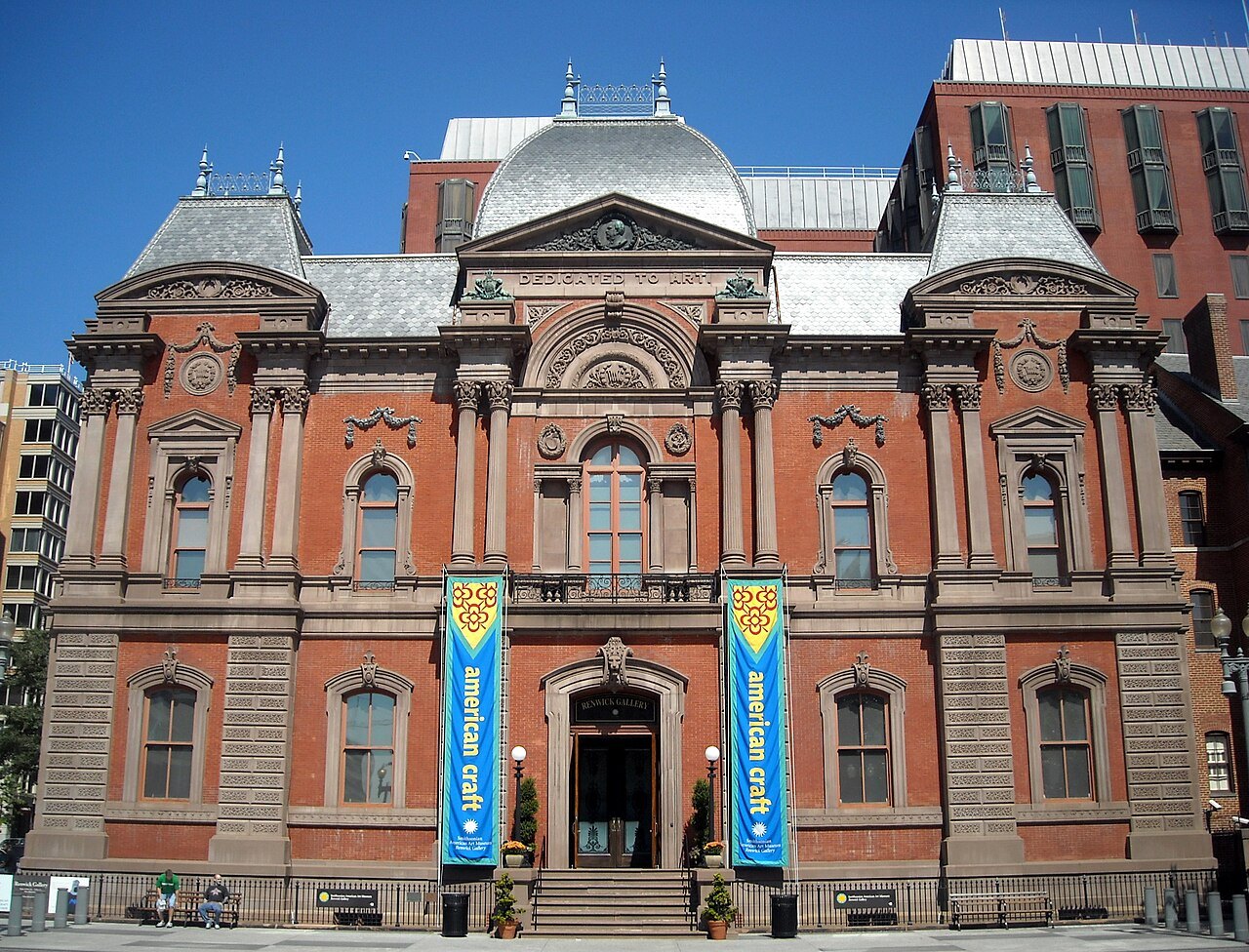 The Renwick Gallery's red-brick front on Pennsylvania Avenue, banners at the door
