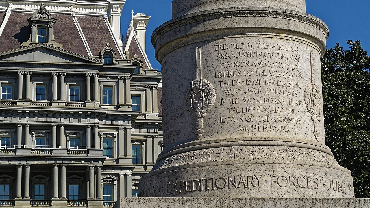 The First Division Monument's inscribed column beside the Eisenhower Executive Office Building
